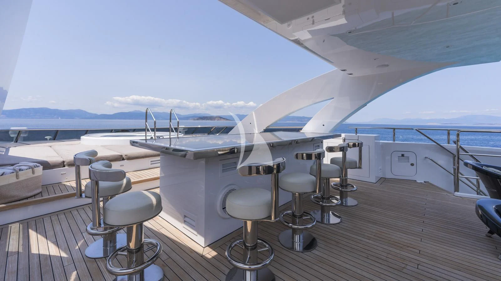 a room with stools and tables aboard BLISS Yacht for Sale
