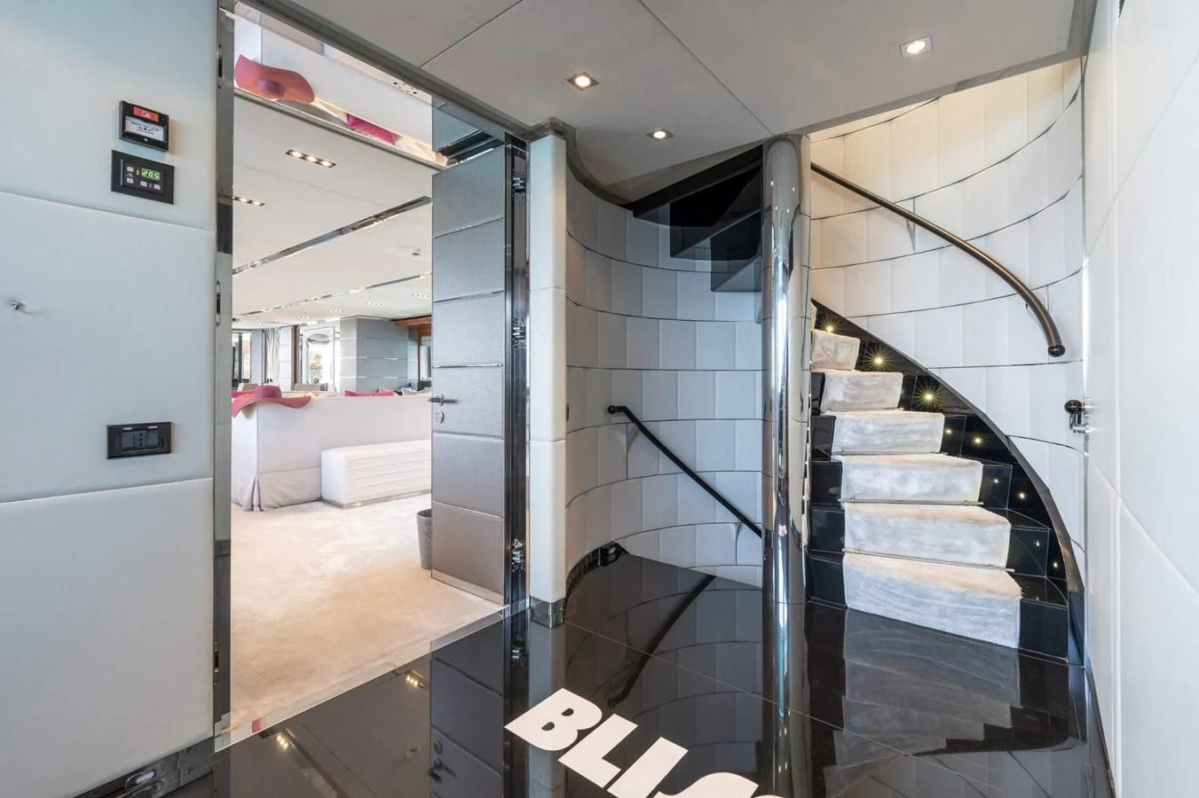 a room with a glass wall and a staircase aboard BLISS Yacht for Sale