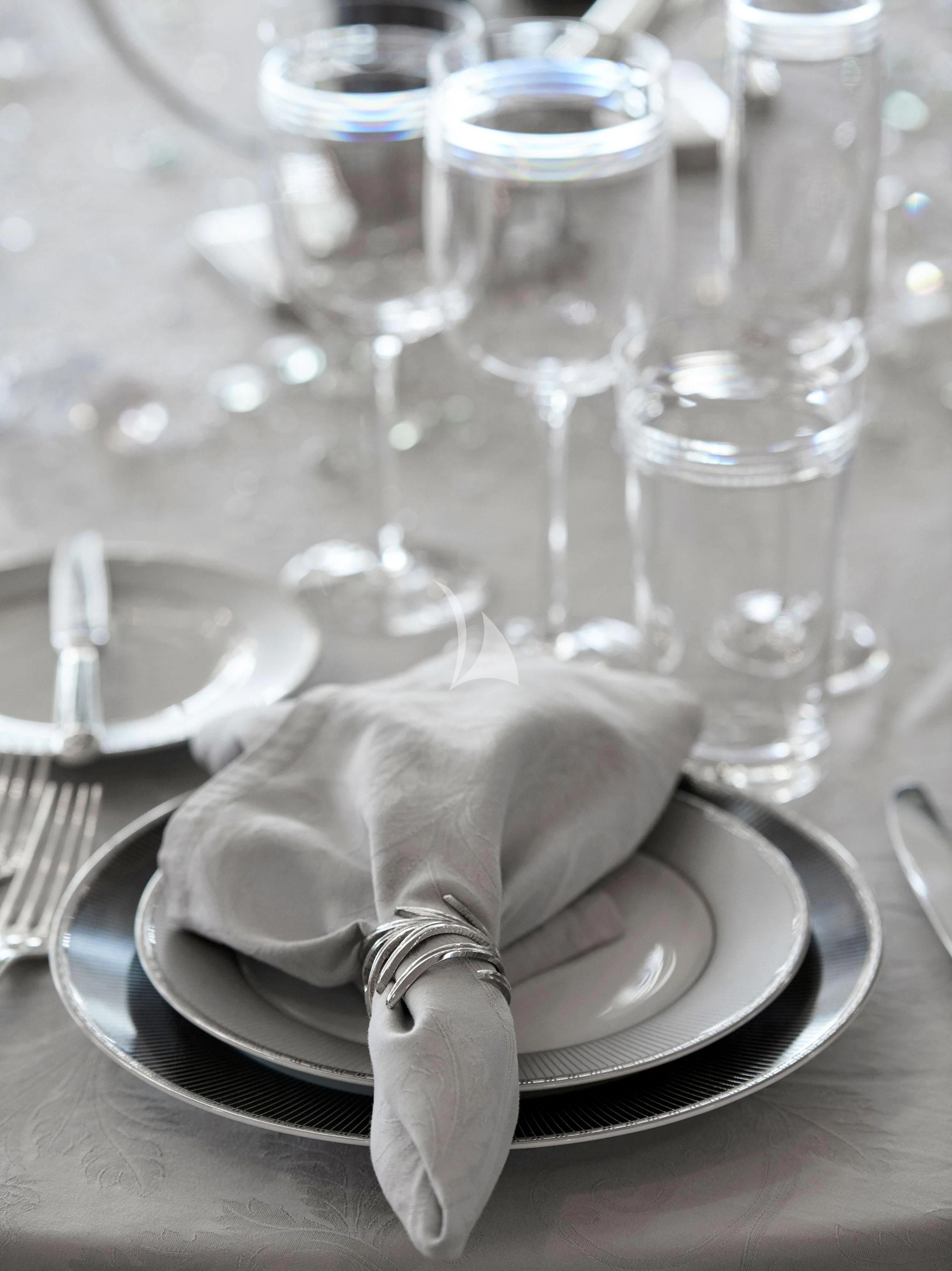 a plate with a napkin and fork on it aboard BLISS Yacht for Sale