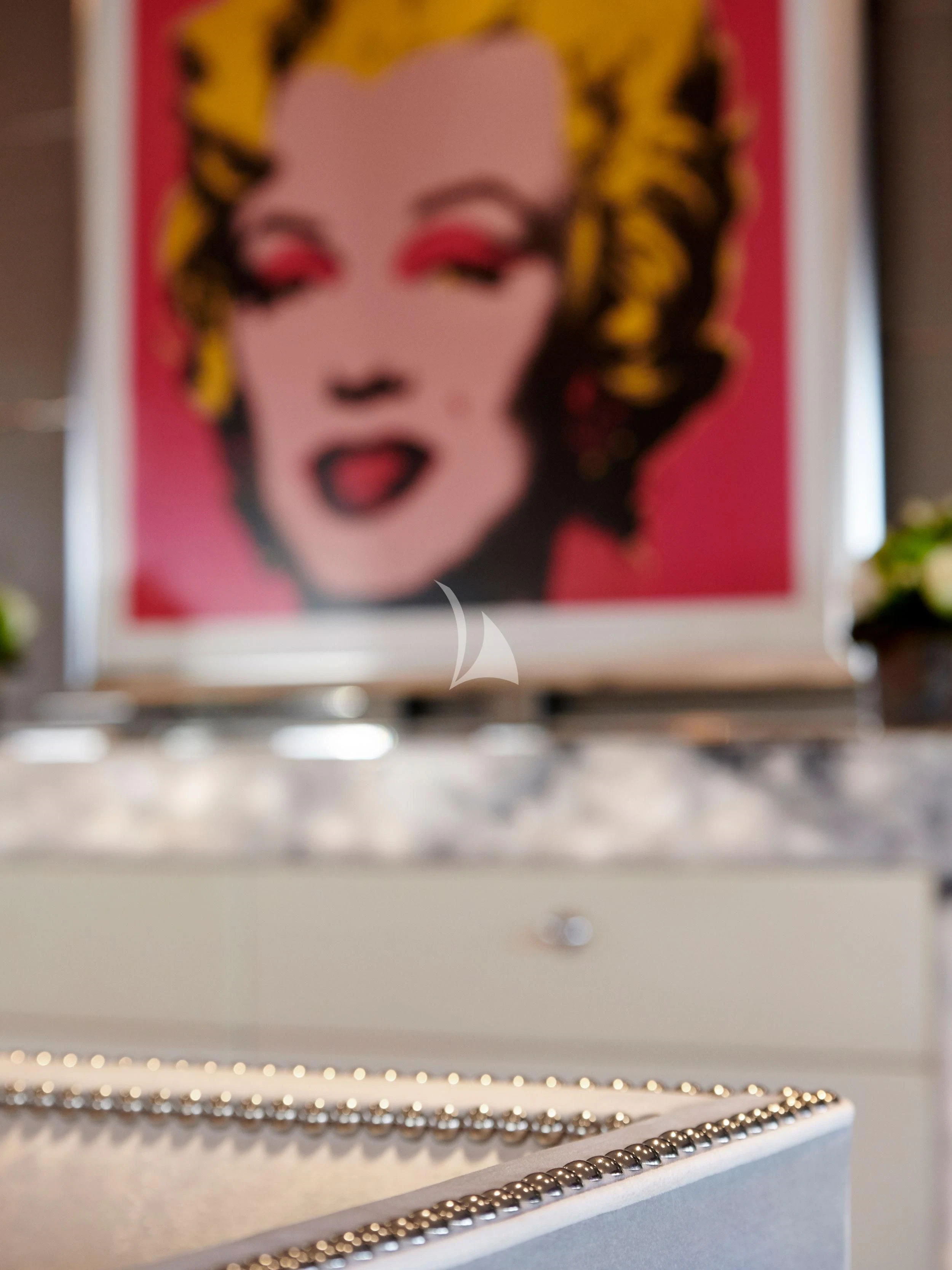 a woman's face on a television screen aboard BLISS Yacht for Sale