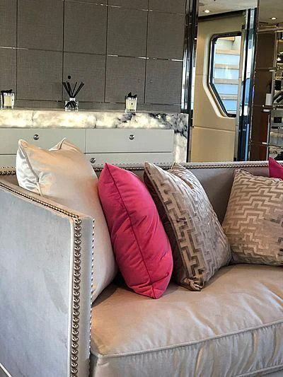 a couch with pillows aboard BLISS Yacht for Sale