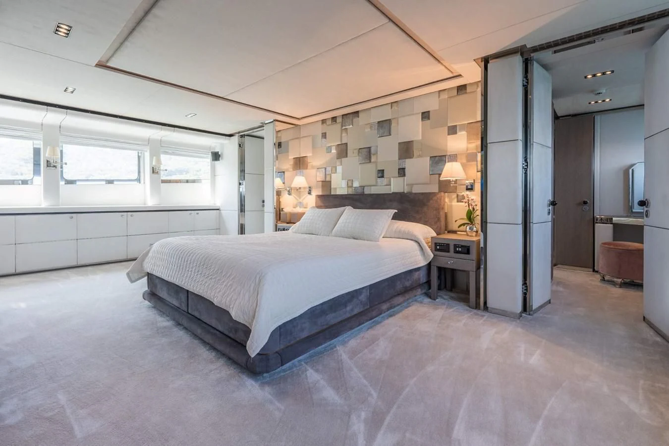 a large bedroom with a large bed aboard BLISS Yacht for Sale