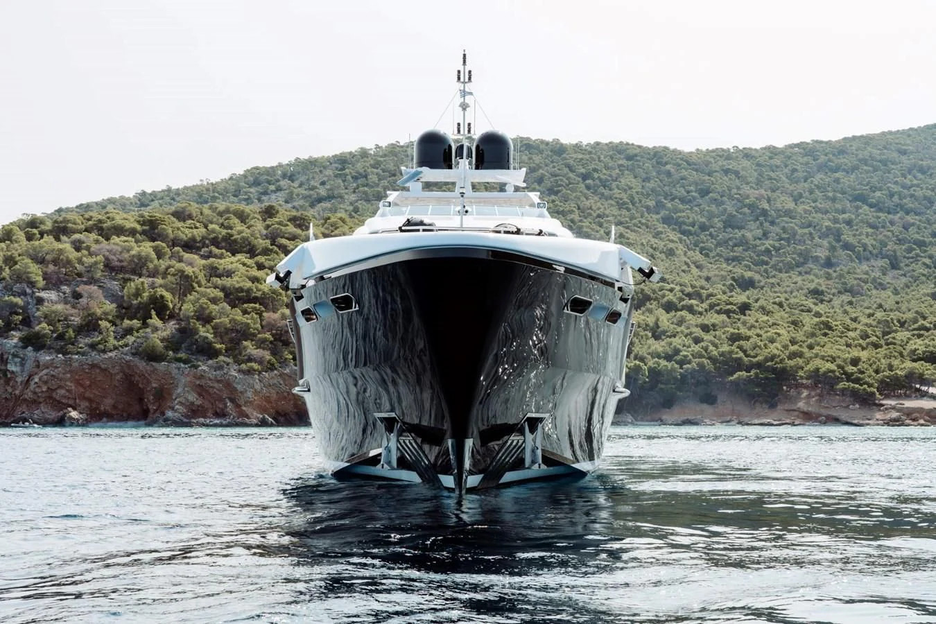 a large ship in the water aboard BLISS Yacht for Sale