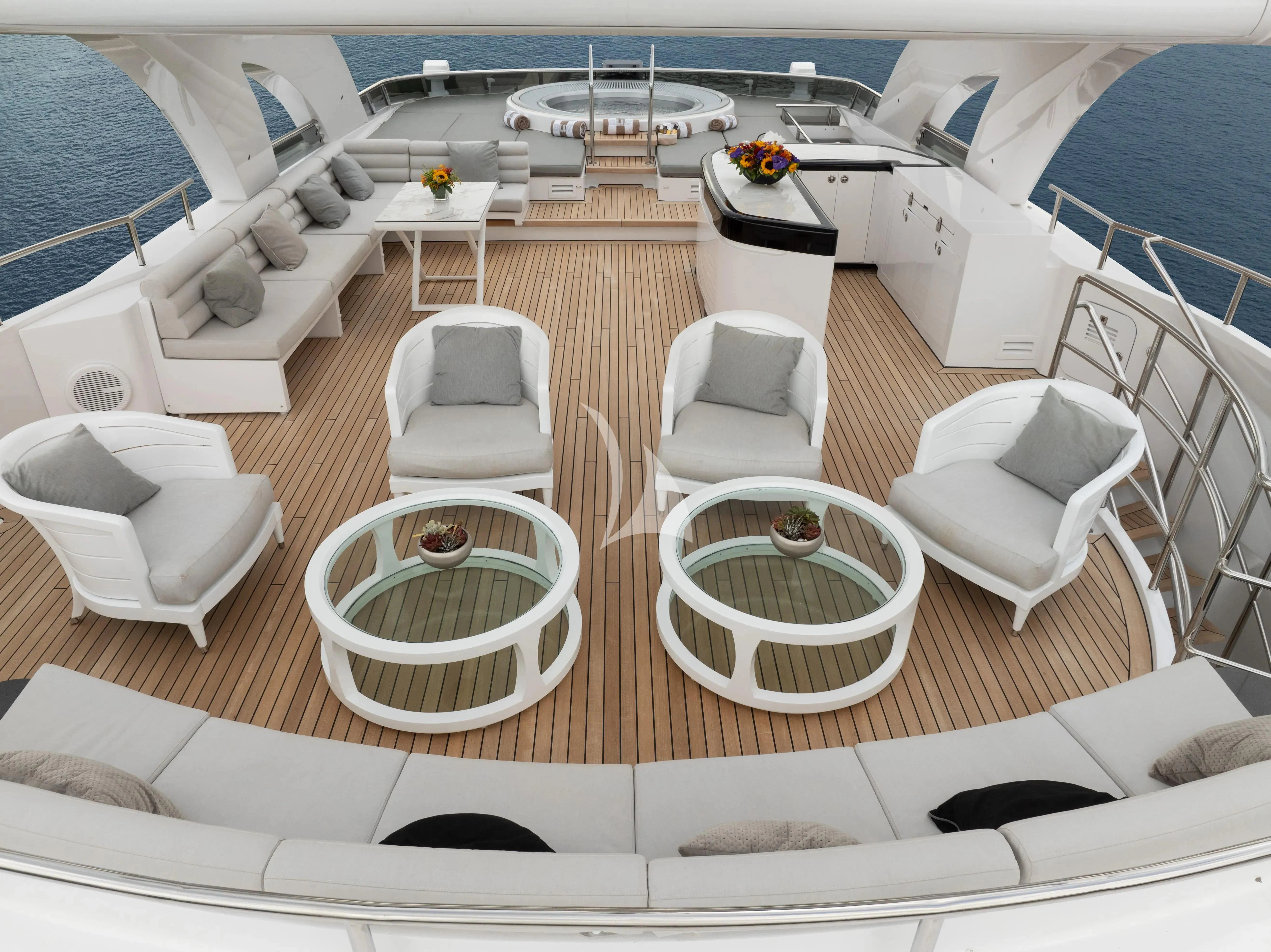 a room with a pool and lounge chairs aboard BLISS Yacht for Sale