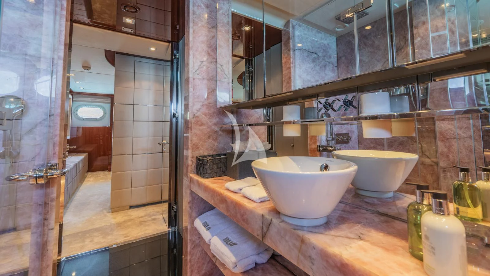 a bathroom with a sink and a bathtub aboard BLISS Yacht for Sale