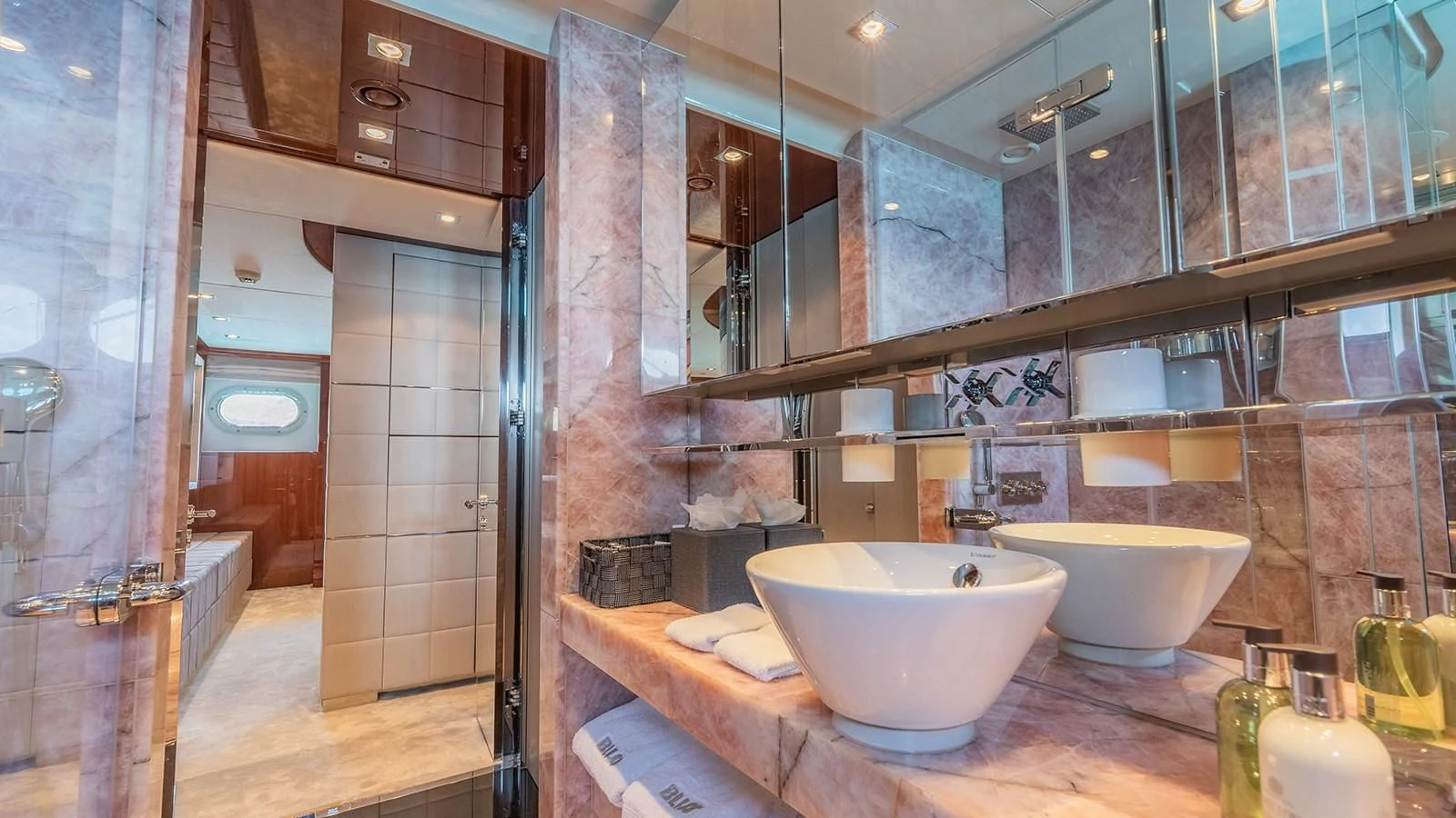 a bathroom with a large mirror aboard BLISS Yacht for Sale