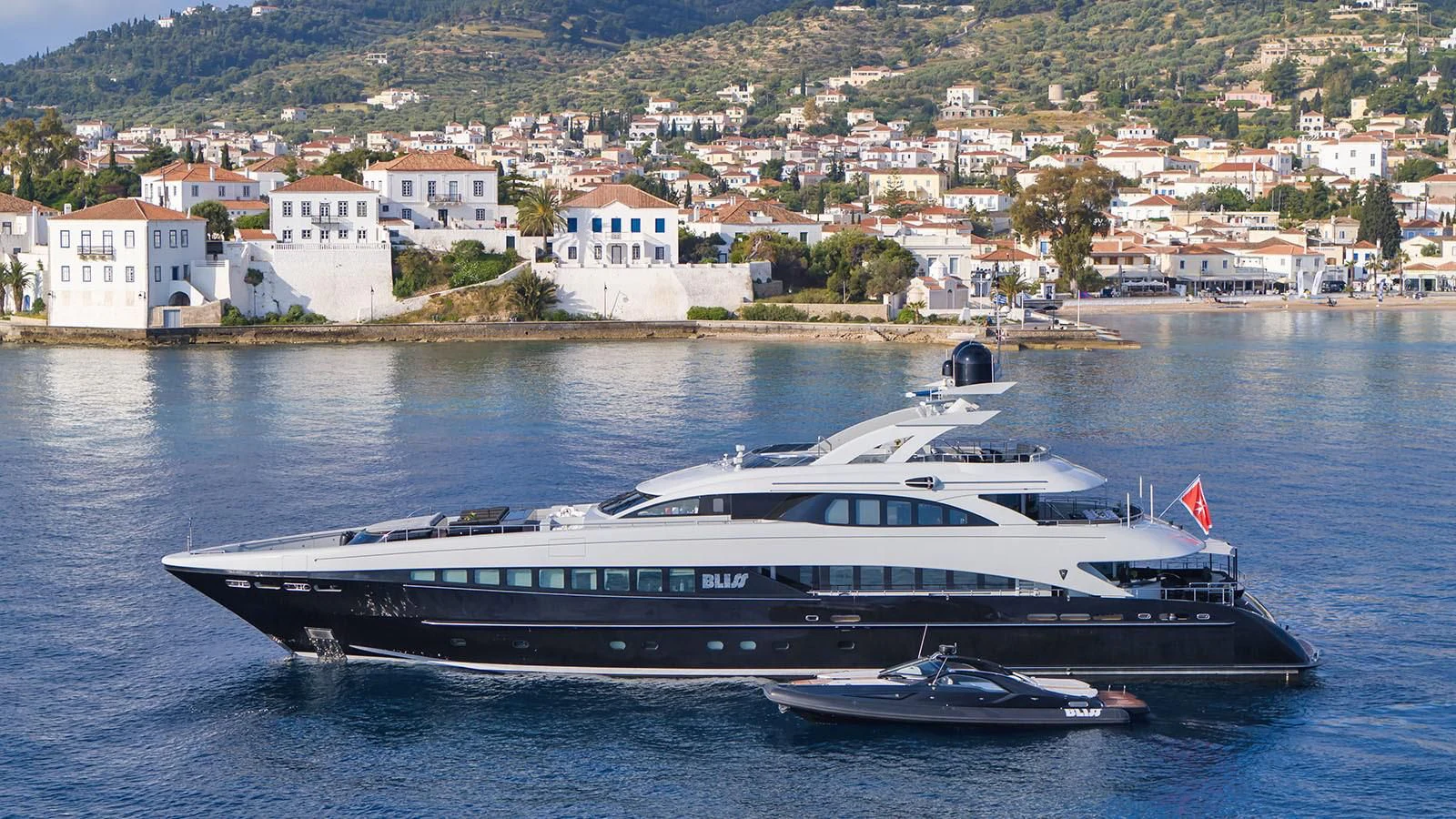 a large white boat in the water aboard BLISS Yacht for Sale