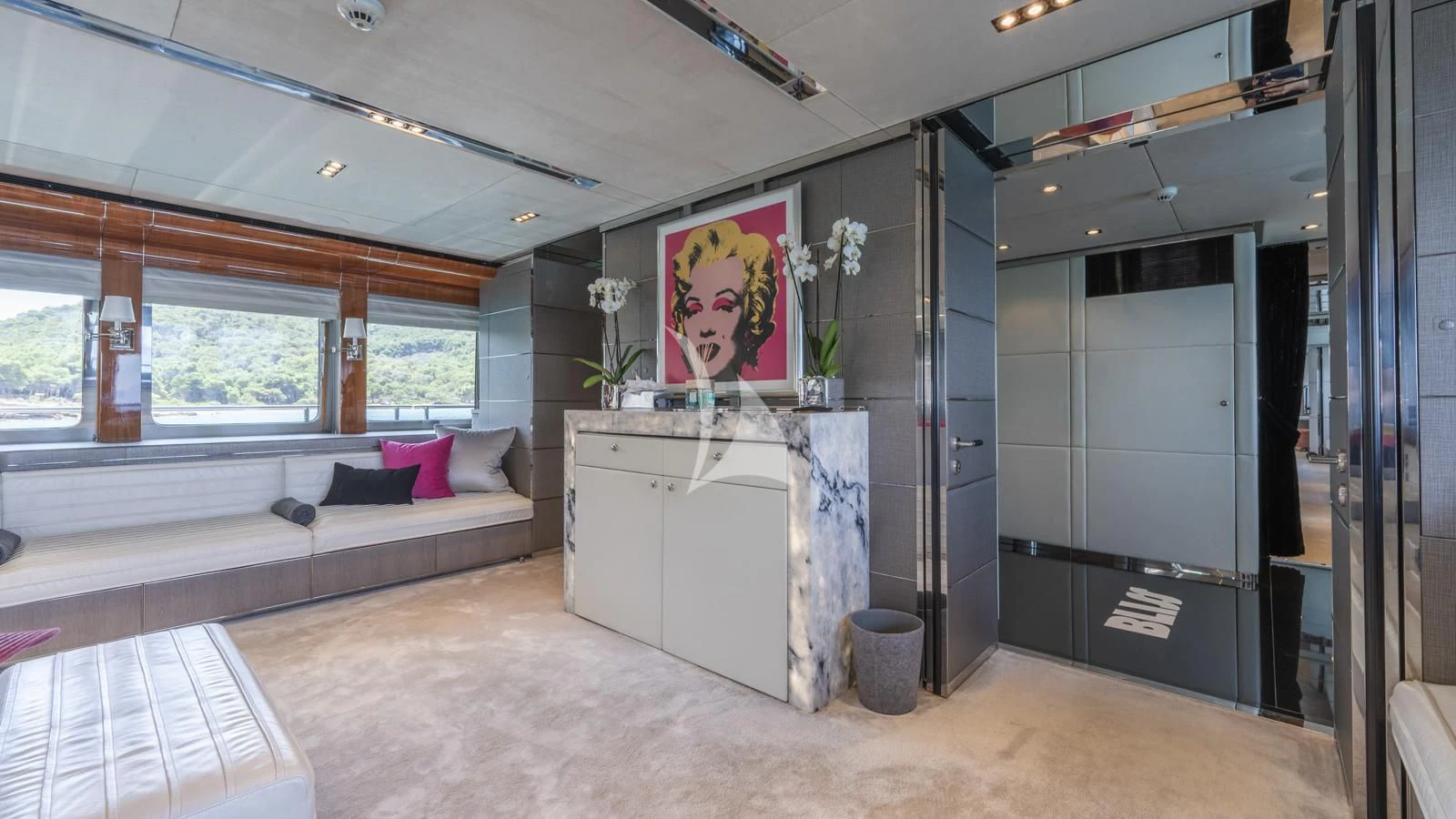 a room with a couch and a table aboard BLISS Yacht for Sale