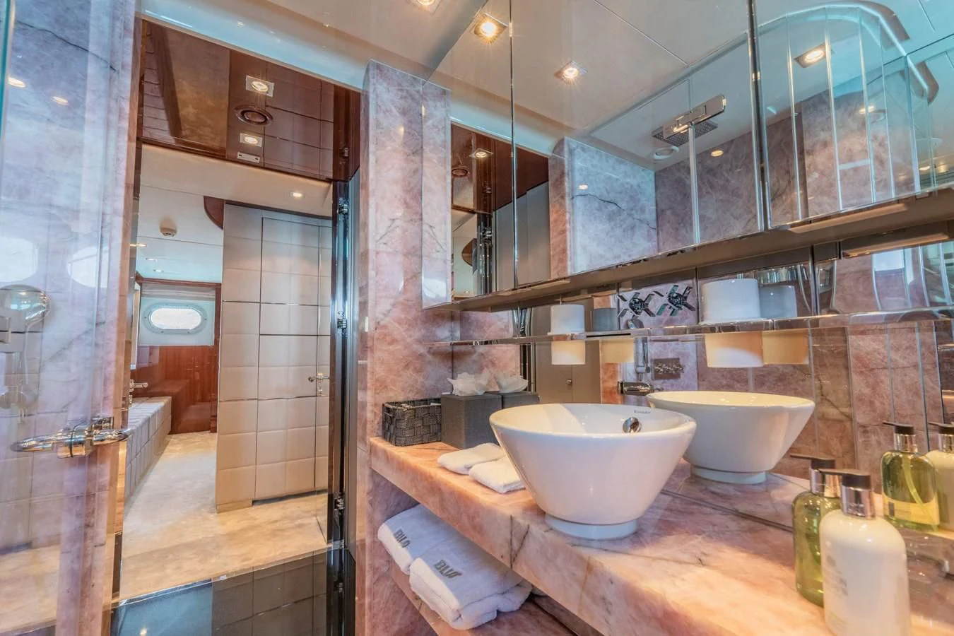a bathroom with a large mirror aboard BLISS Yacht for Sale