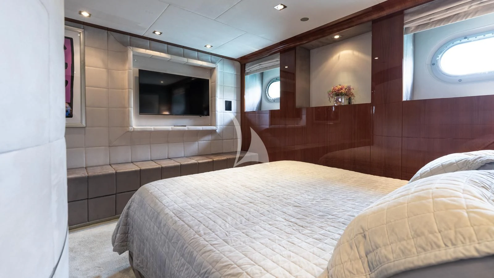 a room with a bed and a television aboard BLISS Yacht for Sale