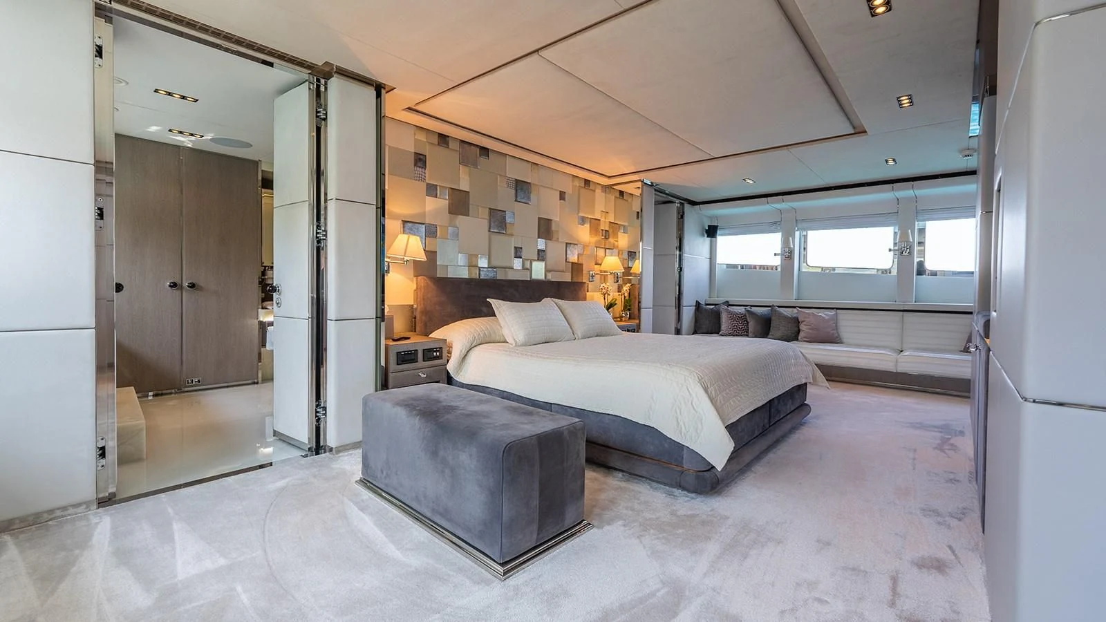 a large bedroom with a bed aboard BLISS Yacht for Sale