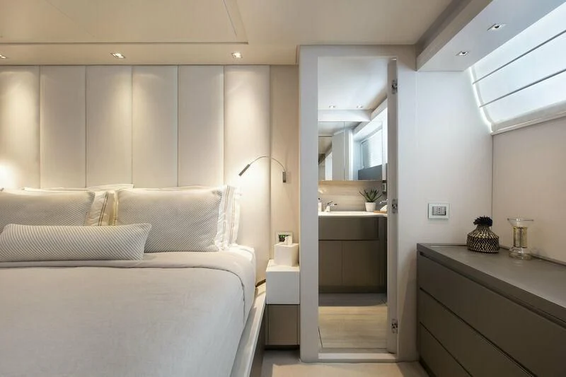 a bedroom with a bed and a mirror aboard SANLORENZO SL82-570 Yacht for Sale