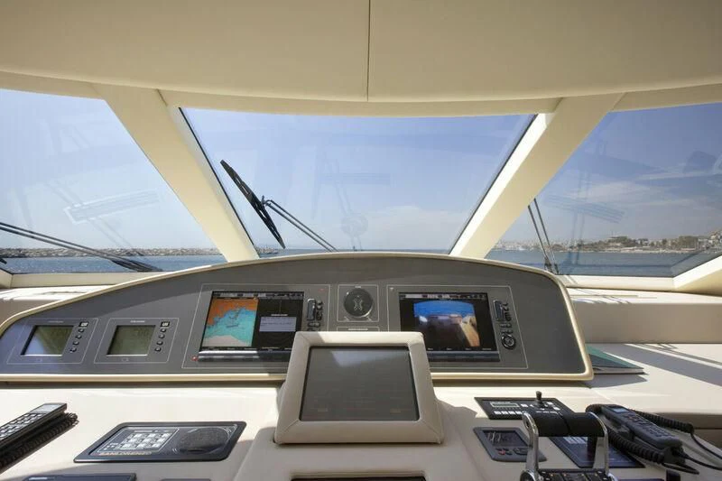 inside of a vehicle with a screen and a laptop on the dashboard with Milwaukee Art Museum in the background aboard SANLORENZO SL82-570 Yacht for Sale