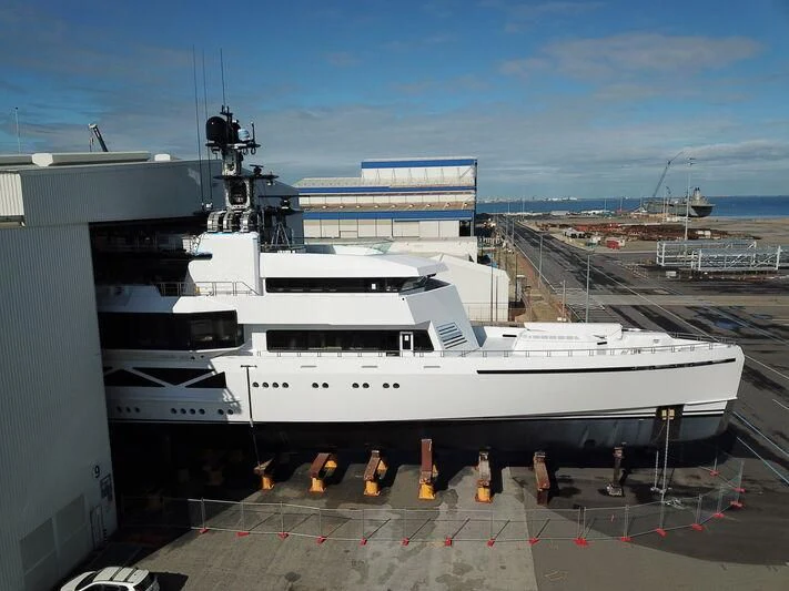 a large white boat in a harbor aboard WANDERLUST Yacht for Charter