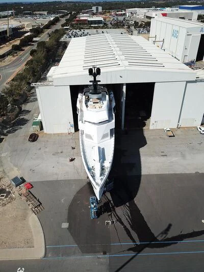 a person standing under an umbrella aboard WANDERLUST Yacht for Charter