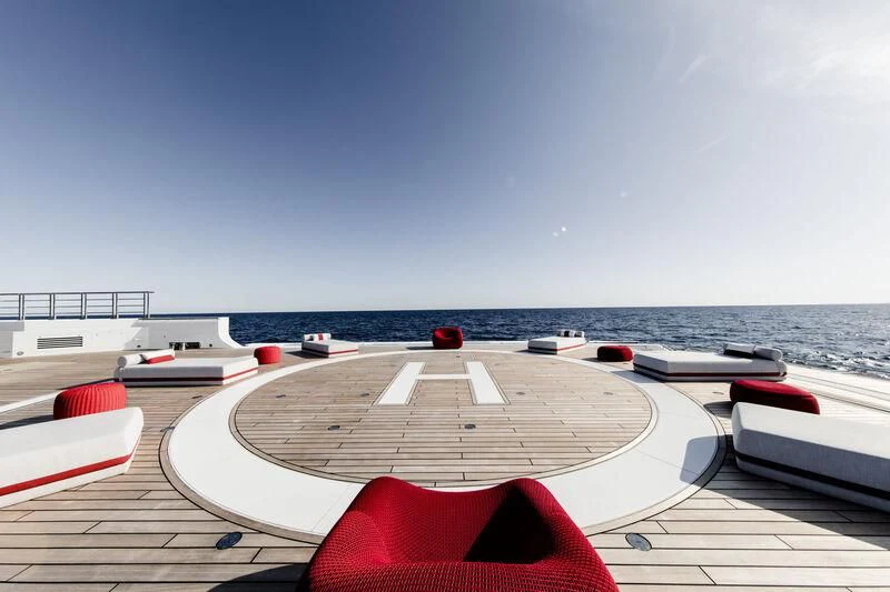 a deck with a view of the ocean and a beach aboard WANDERLUST Yacht for Charter