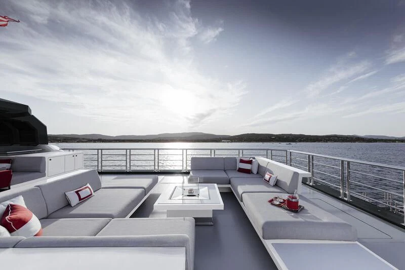 a deck with a view of the ocean and the ocean aboard WANDERLUST Yacht for Charter