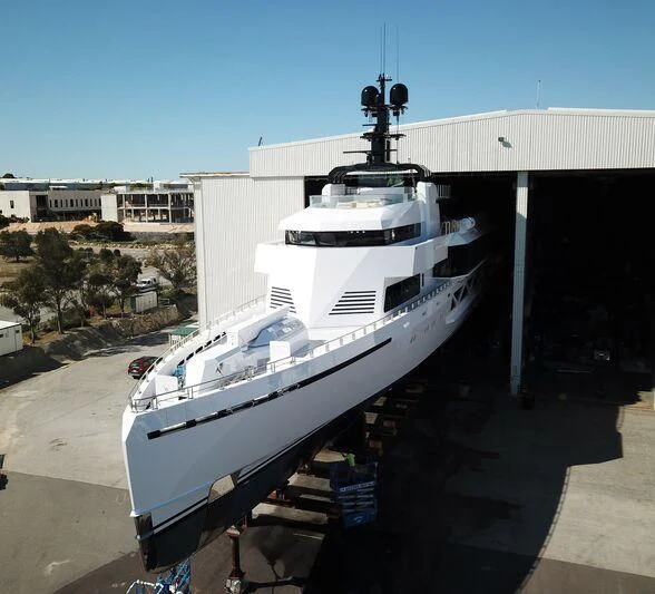 a white yacht docked at a dock aboard WANDERLUST Yacht for Charter