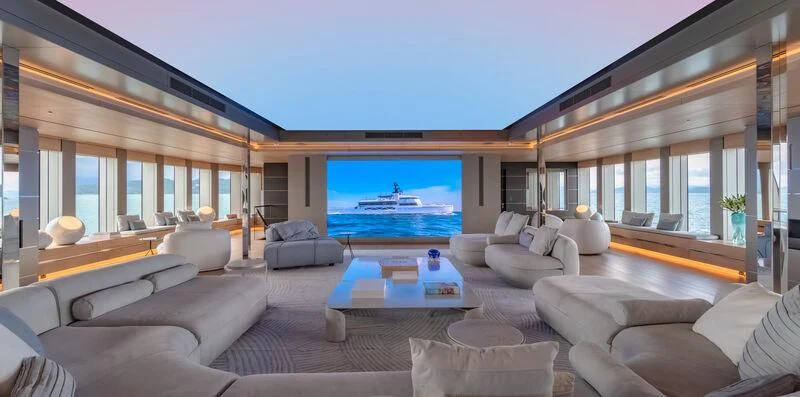 a living room with a large screen aboard WANDERLUST Yacht for Charter
