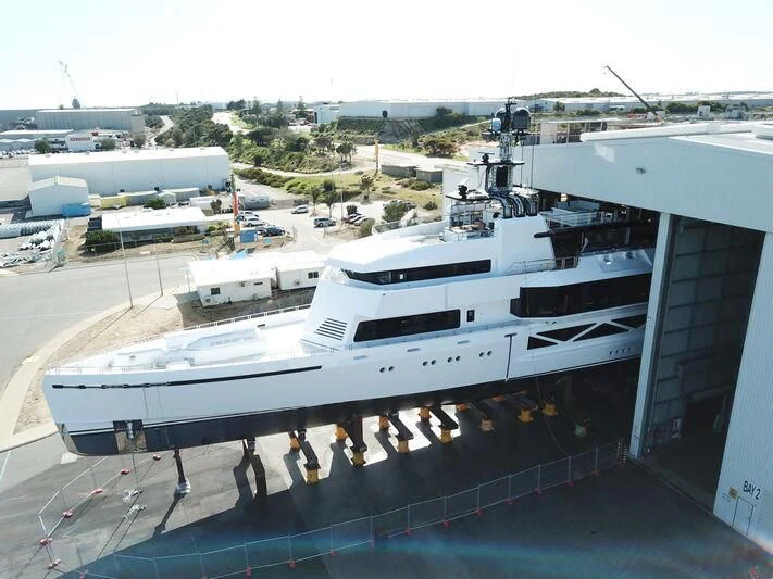 a large white boat in a harbor aboard WANDERLUST Yacht for Charter