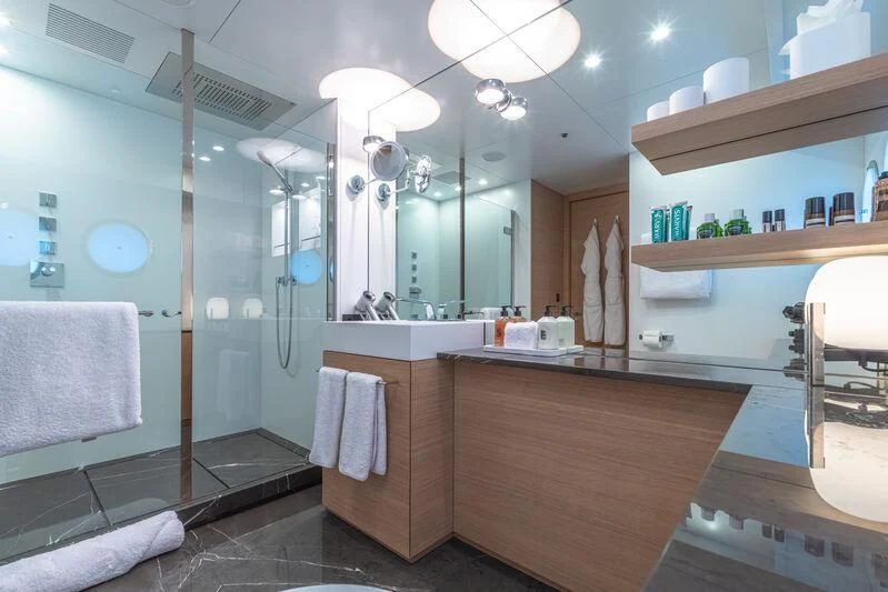 a bathroom with a large mirror aboard WANDERLUST Yacht for Charter