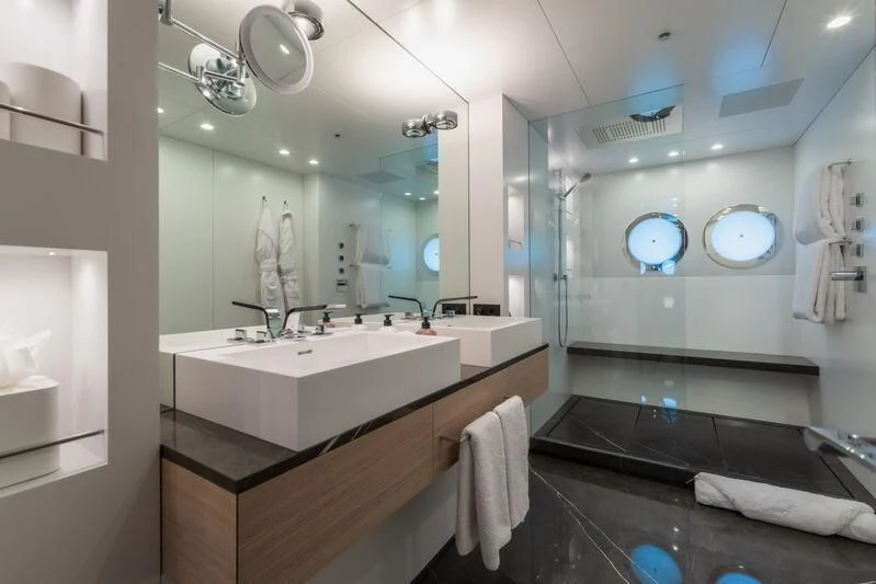a bathroom with a large mirror aboard WANDERLUST Yacht for Charter