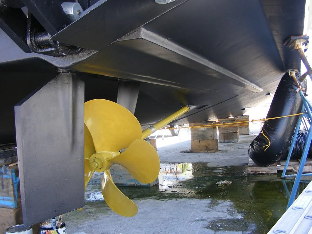 a large yellow balloon under a bridge aboard GRAVITAS Yacht for Charter