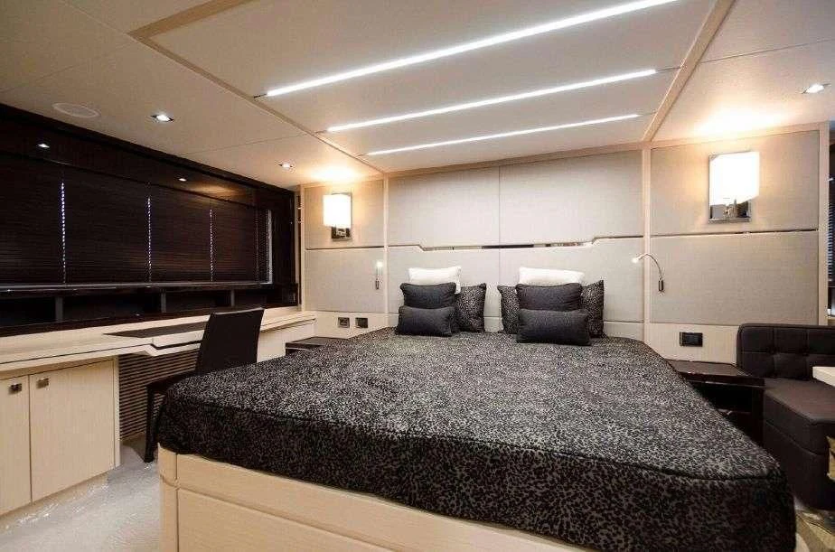 a large bed in a room aboard GRAVITAS Yacht for Charter