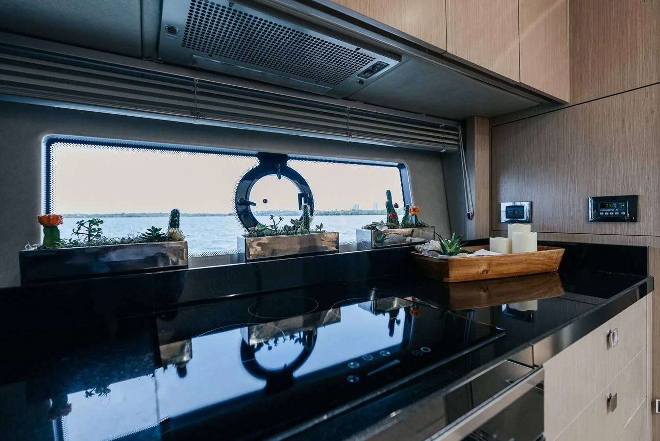 a kitchen with a large window aboard GRAVITAS Yacht for Charter