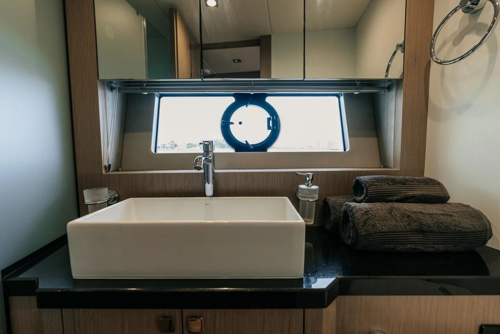 a bathroom with a sink and mirror aboard GRAVITAS Yacht for Charter