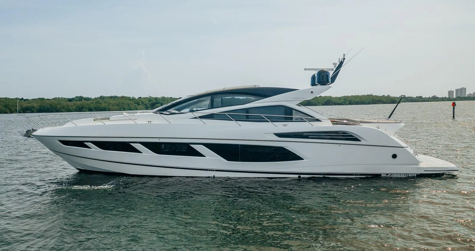 a white boat in the water aboard GRAVITAS Yacht for Charter