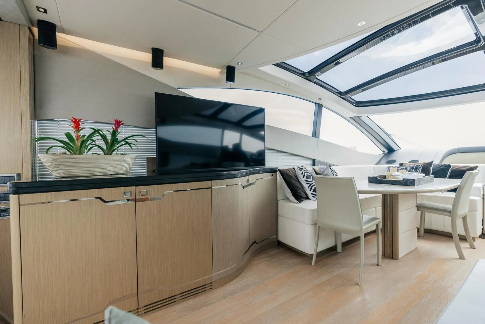a room with a table and chairs aboard GRAVITAS Yacht for Charter