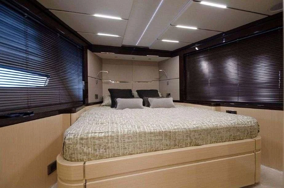 a large bed in a room aboard GRAVITAS Yacht for Charter