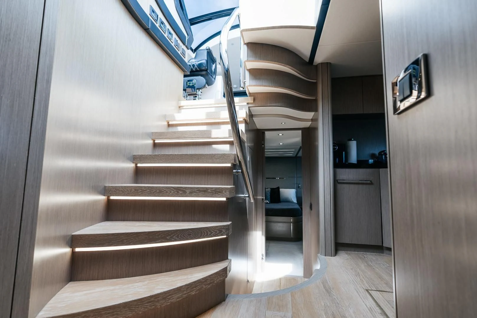 a staircase with a glass door aboard GRAVITAS Yacht for Charter