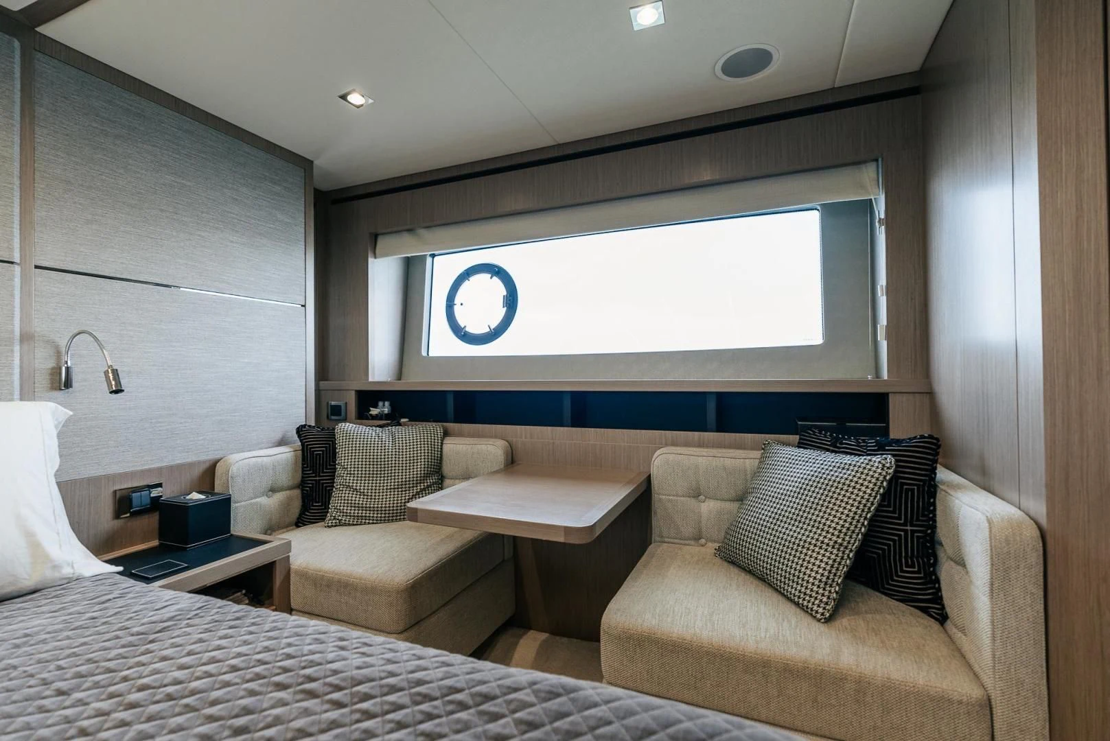 a room with a couch and a tv aboard GRAVITAS Yacht for Charter