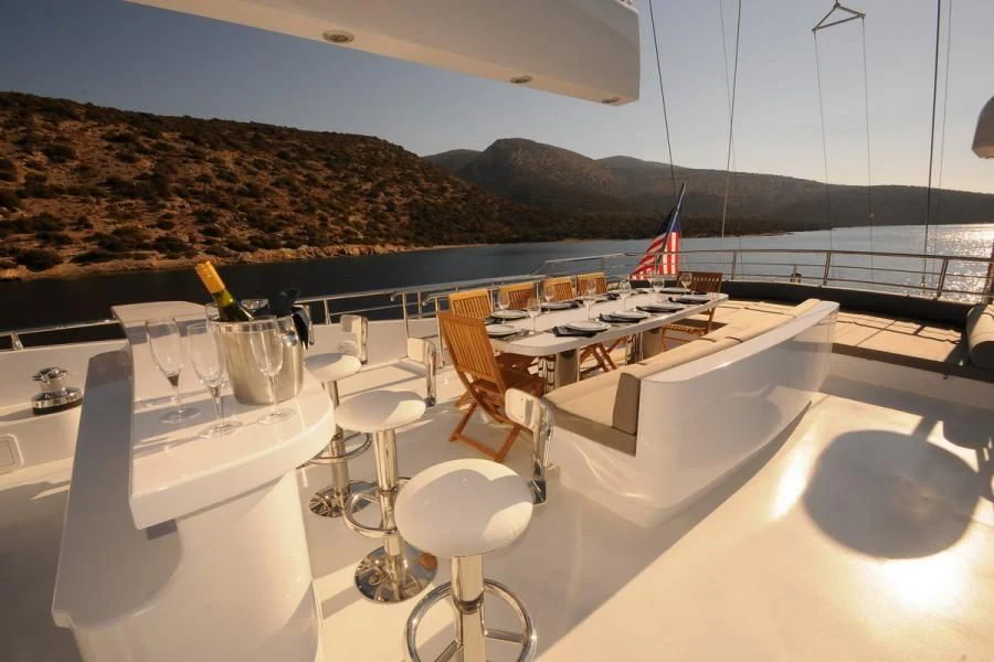 a table and chairs on a boat aboard CANARIA Yacht for Sale