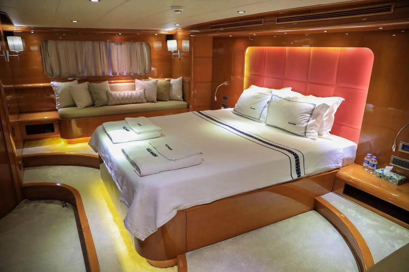a room with a bed and a couch aboard CANARIA Yacht for Sale
