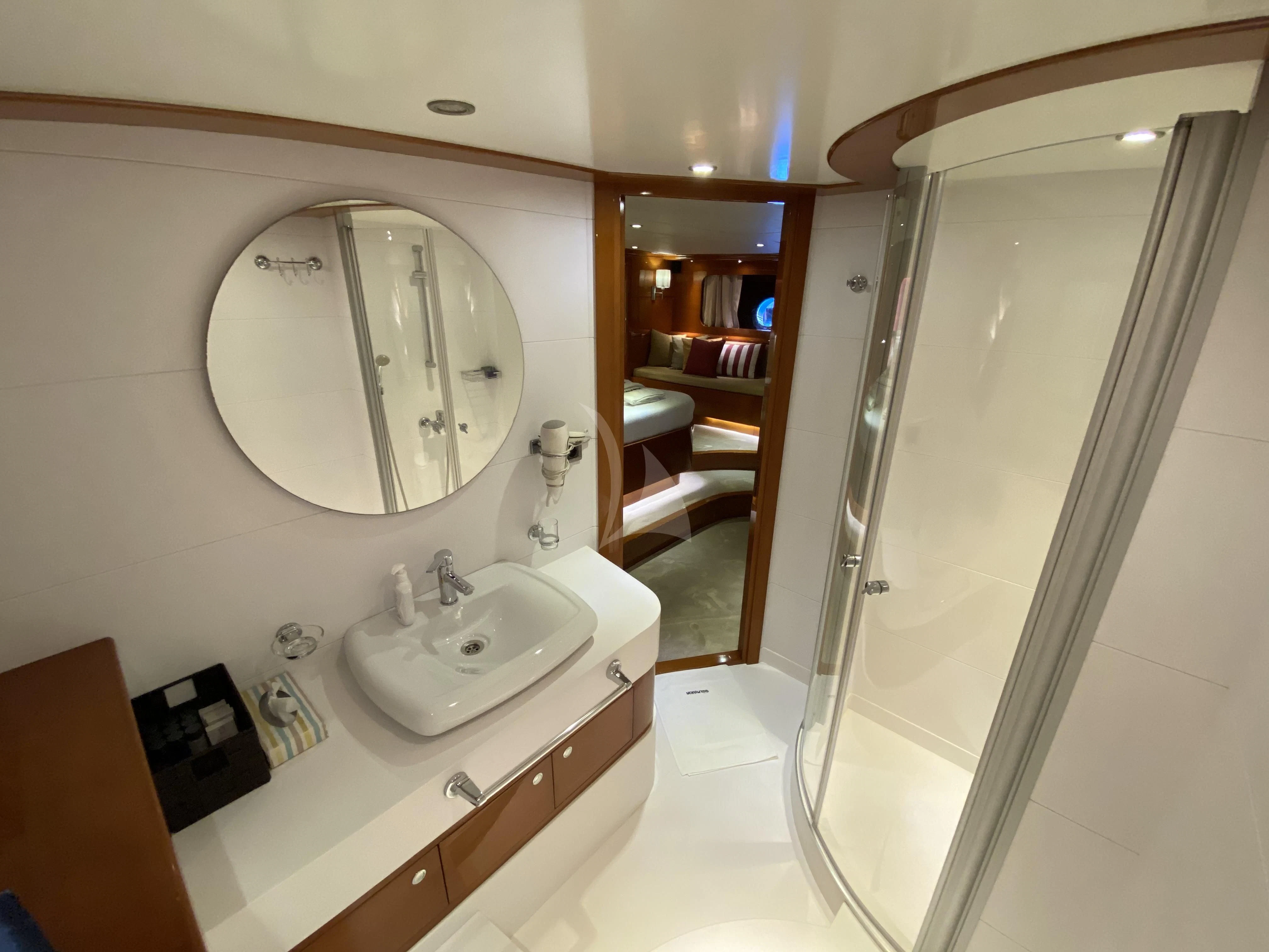 a bathroom with a large mirror aboard CANARIA Yacht for Sale