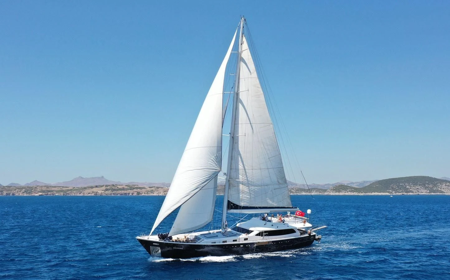 a sailboat in the water aboard CANARIA Yacht for Sale