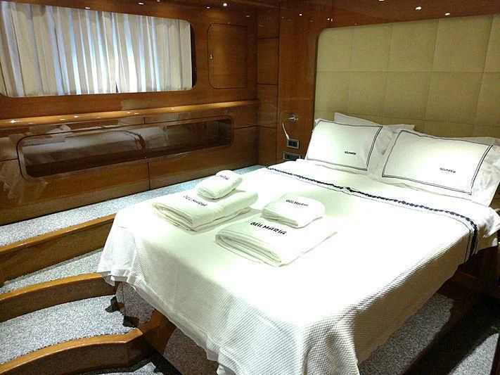 a room with beds and a bed aboard CANARIA Yacht for Sale
