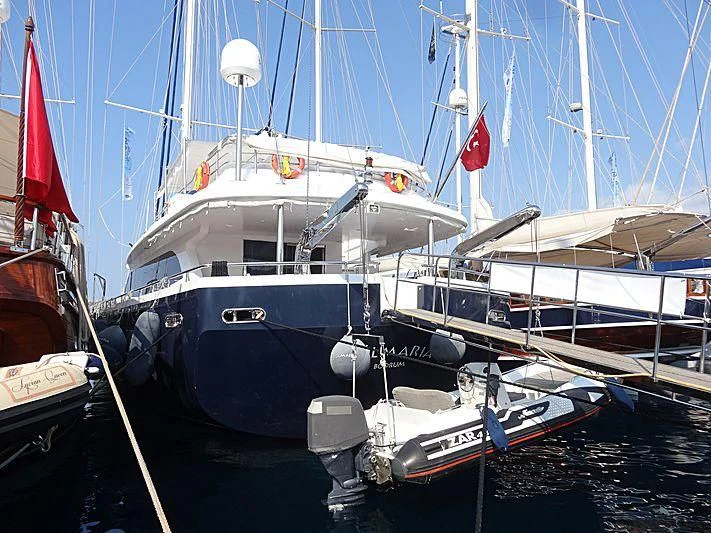 a boat docked at a pier aboard CANARIA Yacht for Sale