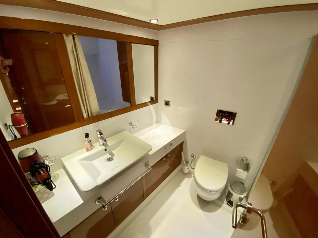 a bathroom with a large mirror aboard CANARIA Yacht for Sale