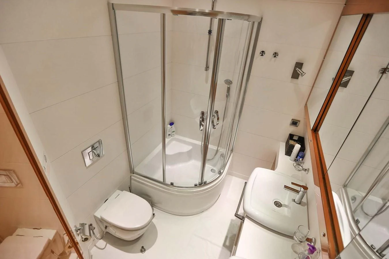 a bathroom with a shower and toilet aboard CANARIA Yacht for Sale
