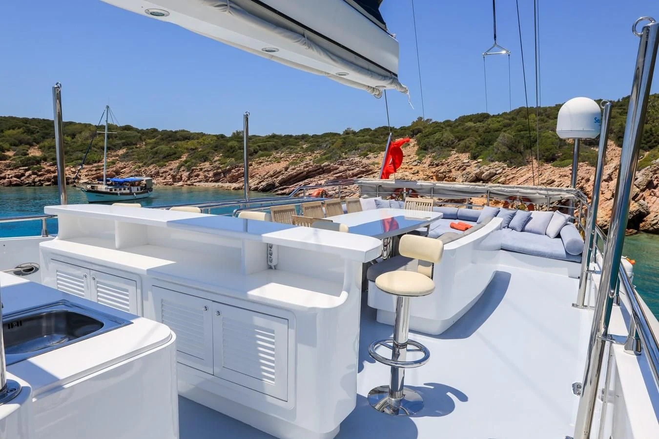 a boat with a chair on the deck aboard CANARIA Yacht for Sale