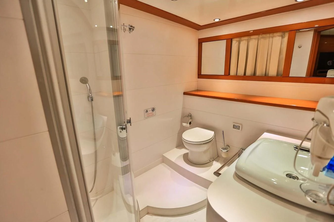a bathroom with a shower and toilet aboard CANARIA Yacht for Sale