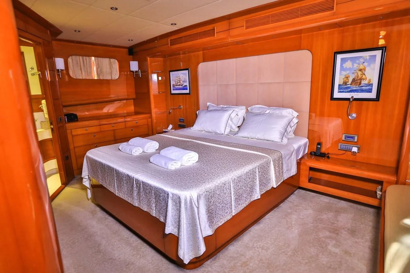 a bed with white sheets aboard CANARIA Yacht for Sale