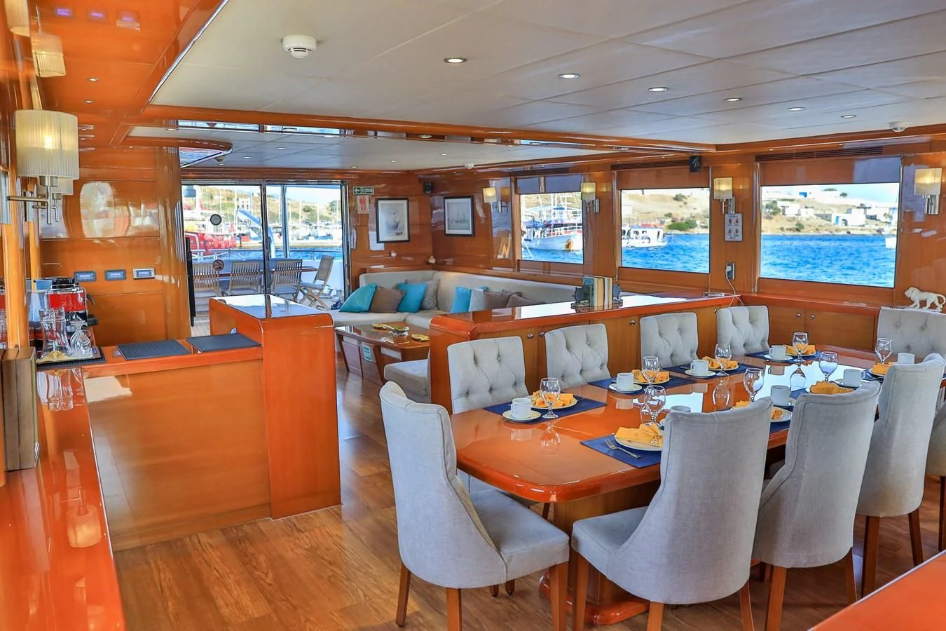 a restaurant with tables and chairs aboard CANARIA Yacht for Sale