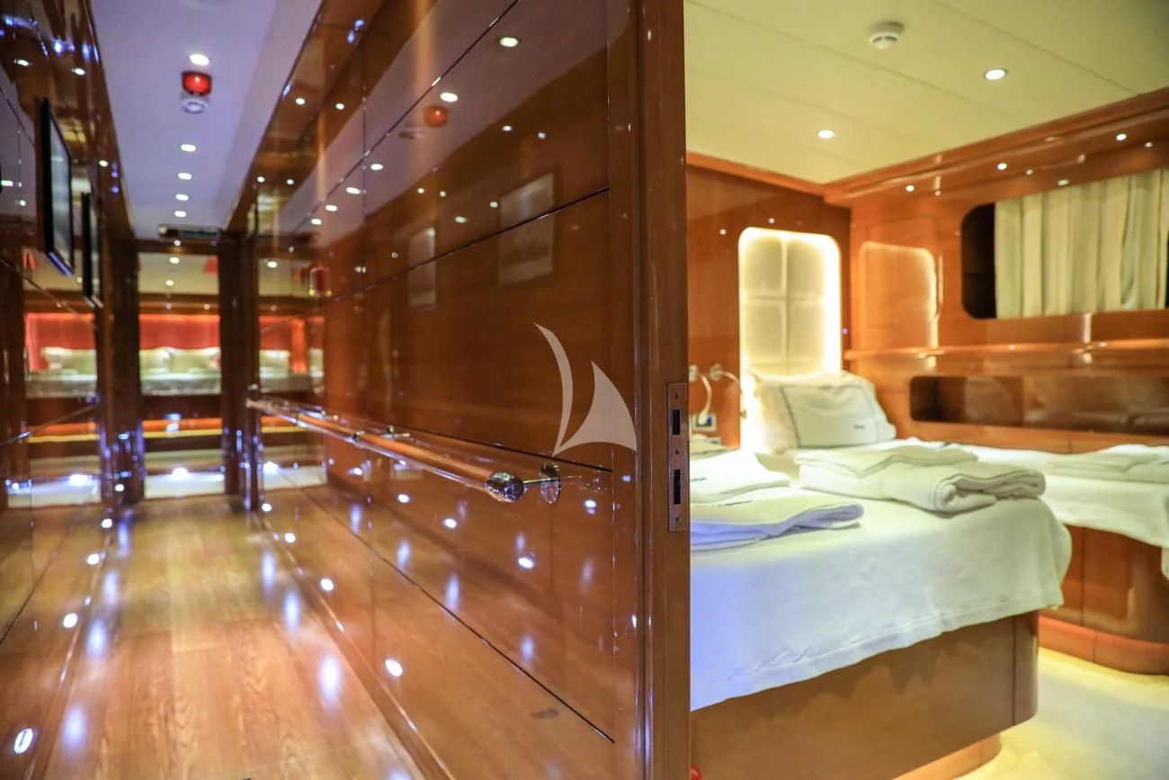 a room with wooden walls and a bed aboard CANARIA Yacht for Sale