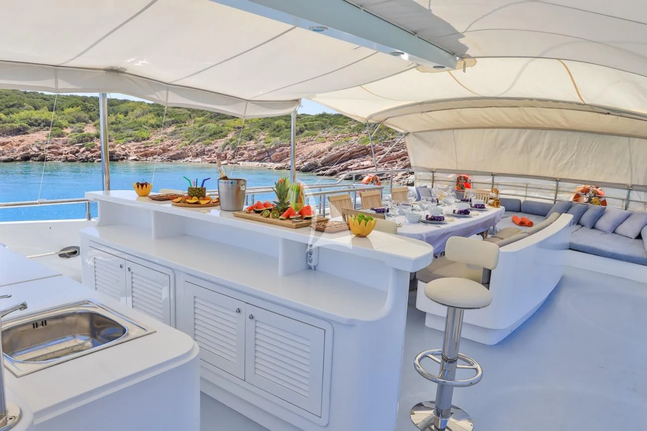a white table with fruit on it aboard CANARIA Yacht for Sale