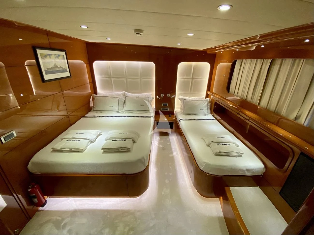a room with a bed and a chair aboard CANARIA Yacht for Sale